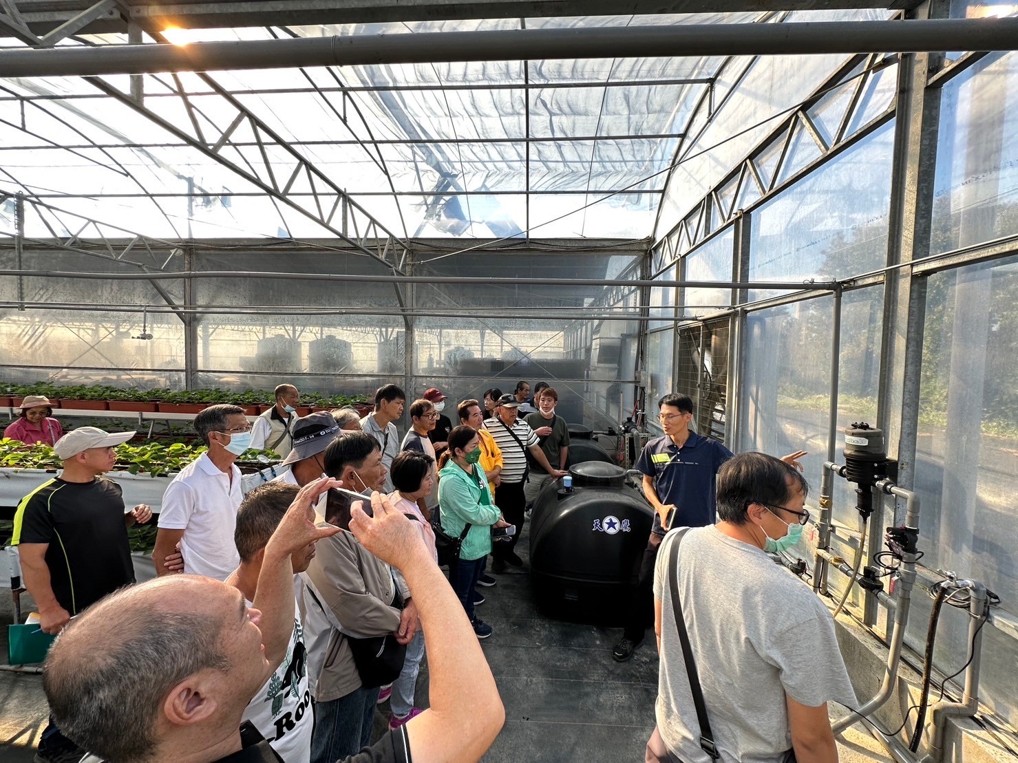 Fig. 3. Farmers’ Visit to Learn About Automated Management of Greenhouse Strawberries